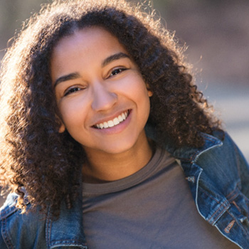 Smiling girl showing off her straighter smile 
